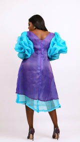 Long sleeve Purple and teal three quarter dress with sequin detailing. And long sleeve. Look 3