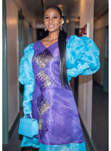 Long sleeve Purple and teal three quarter dress with sequin detailing. And long sleeve. Look 3