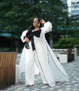 White kimono with black bow sequin and white wide leg pants Look 17