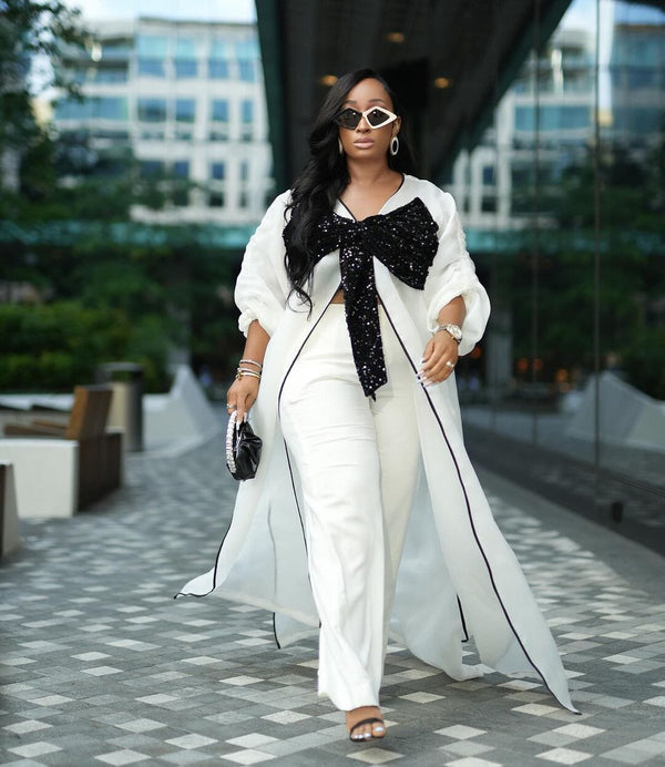 White kimono with black bow sequin and white wide leg pants Look 17