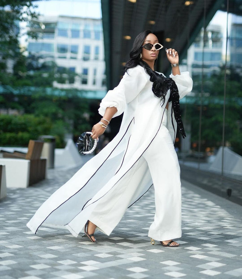 White kimono with black bow sequin and white wide leg pants Look 17