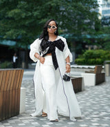 White kimono with black bow sequin and white wide leg pants Look 17